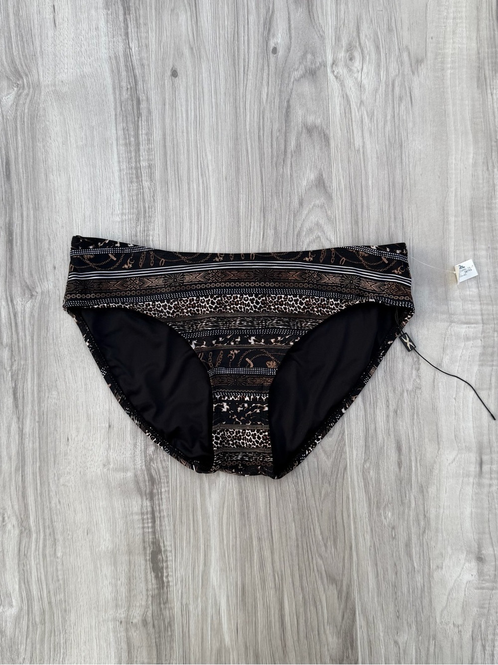 Nip Tuck Swim bikini bottoms feature a multi-patterned design